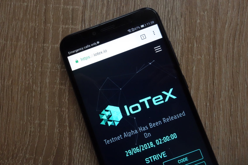 IOTX logo on a mobile phone screen