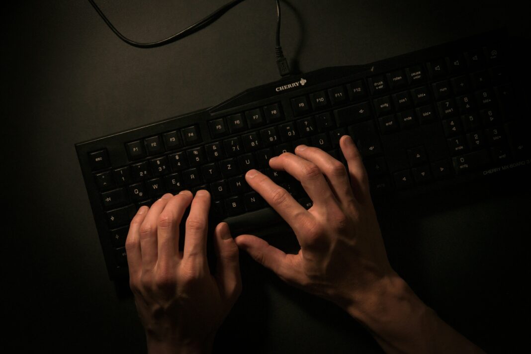 Cybercrime fingers typing