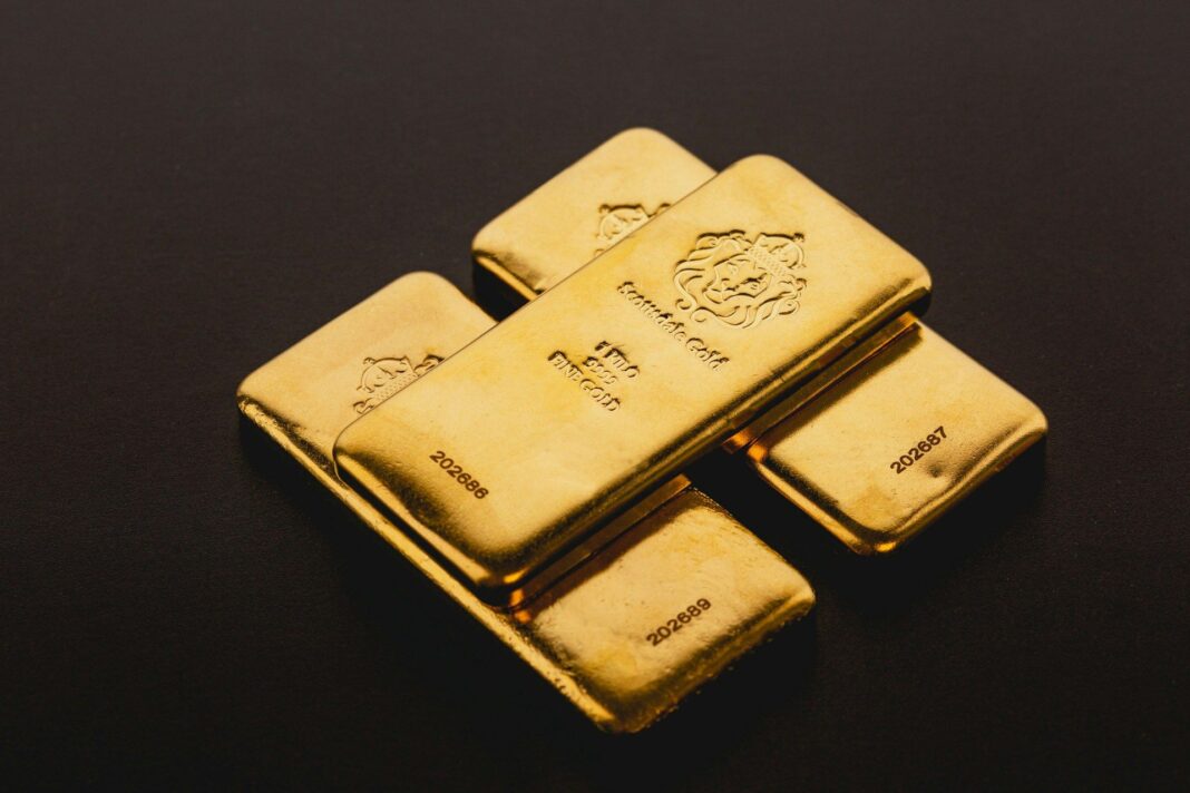 Stacked gold bars (Scottsdale Mint/Unsplash)